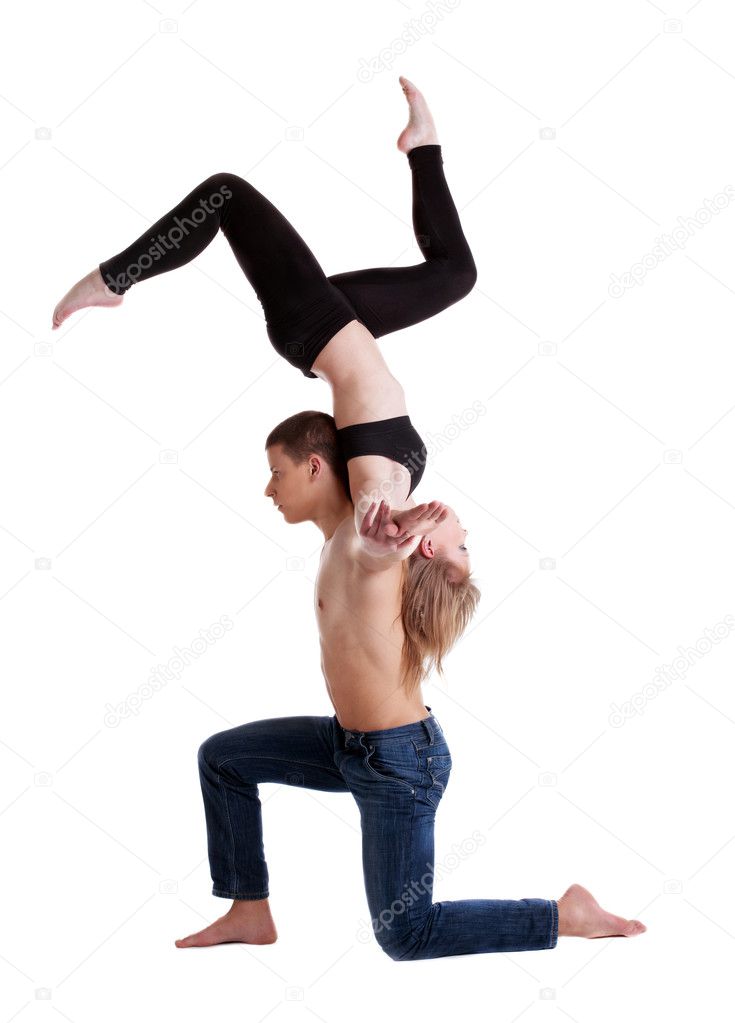 Two young acrobats show stand on hand