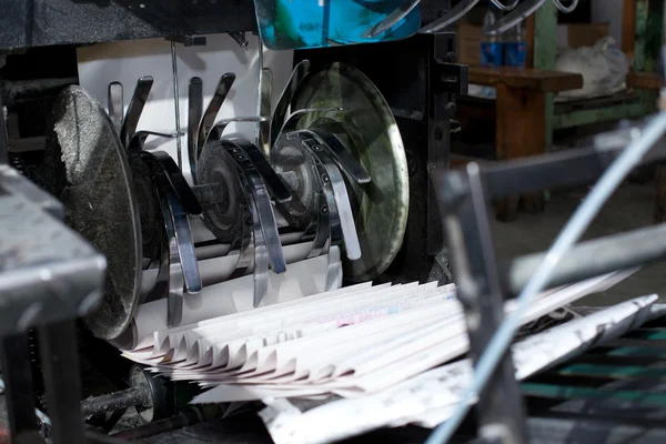 stock image Ready newspaper on production line in a print shop