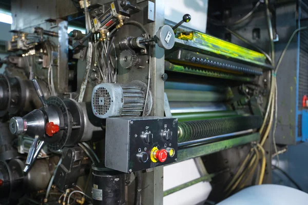 Print shop machine detail yellow color close-up — Stock Photo, Image