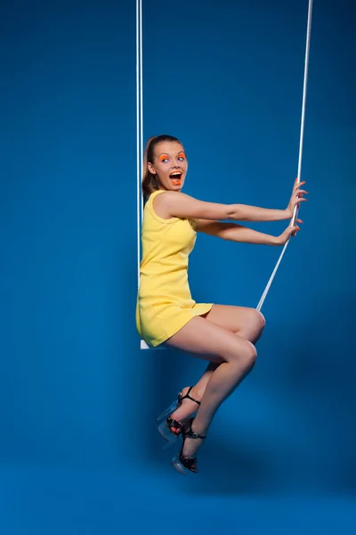 Sexy woman smile on swing with uv make-up — Stock Photo, Image