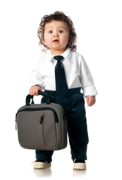 Barn klädd i en affär med en väska — Stockfoto