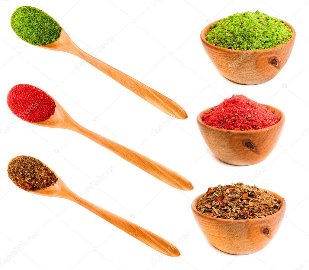 Spices in a wooden platters and spoons