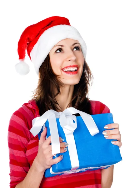 Meisje in kerstmuts met geschenken — Stockfoto