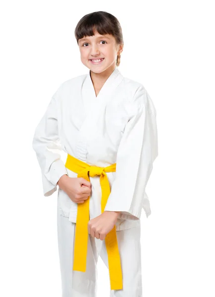 En liten jente i kimono med gult belte. – stockfoto