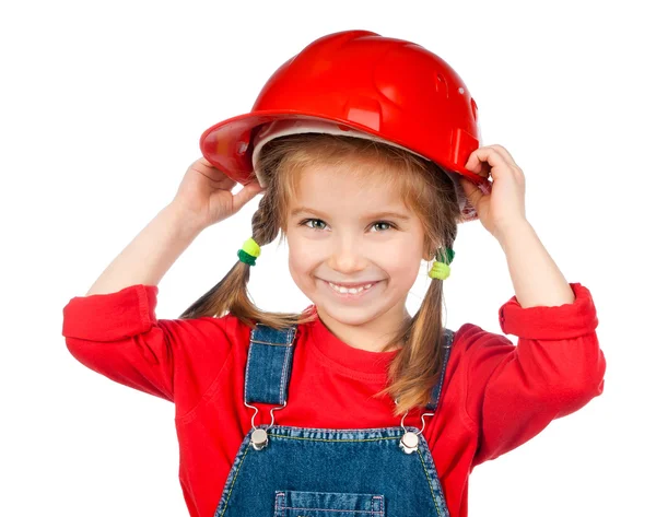 Красивая маленькая девочка в строительном шлеме — стоковое фото