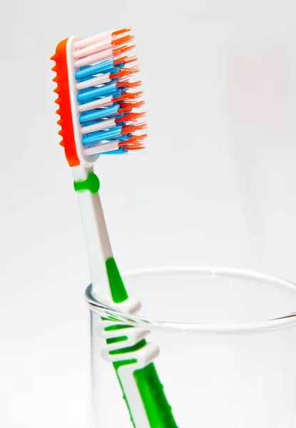 Toothbrush in a glass beaker — Stock Photo, Image