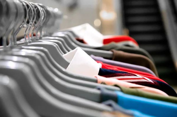 Garment hanging on hangers — Stock Photo, Image