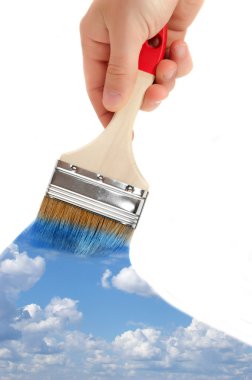 Brush in hand paints the sky clipart