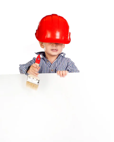Little boy in helmet against with banner — Stock Photo, Image