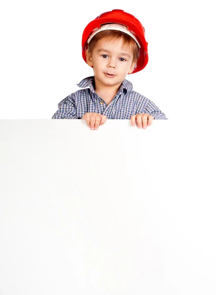 Menino no capacete contra com banner — Fotografia de Stock