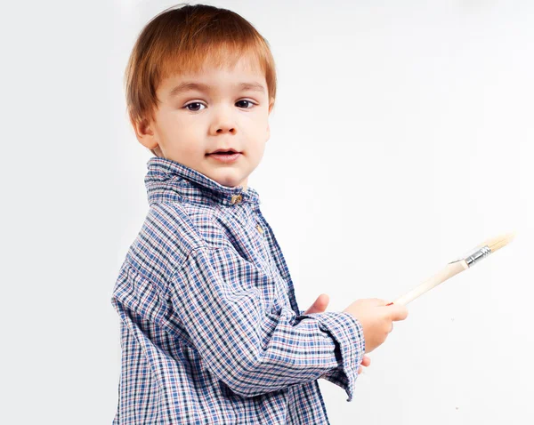 Niño con pincel — Foto de Stock