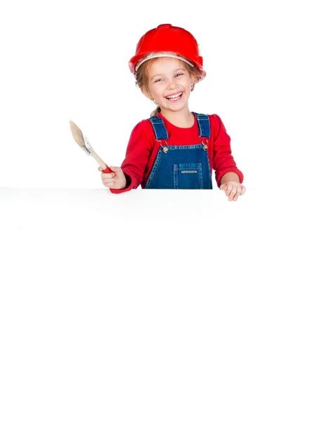 Little girl with a brush and white banner — Stock Photo, Image