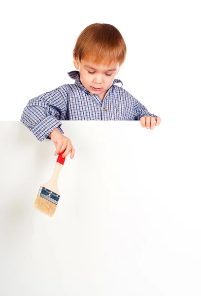 Kleine jongen met een penseel — Stockfoto