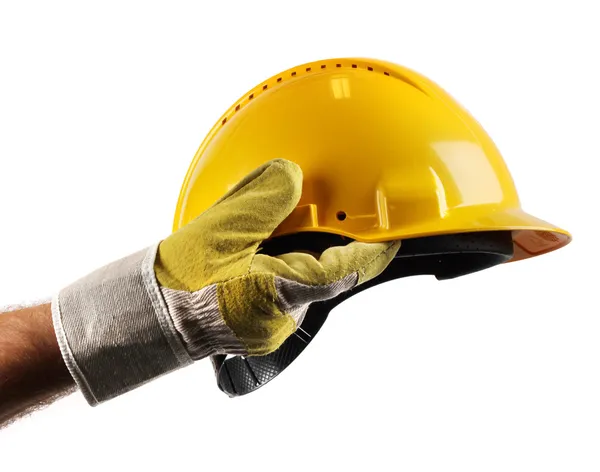 Hard hat in workers hand — Stock Photo, Image