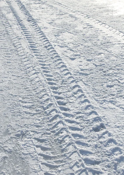 Vehicle tyre tracks on snow — Stock Photo, Image