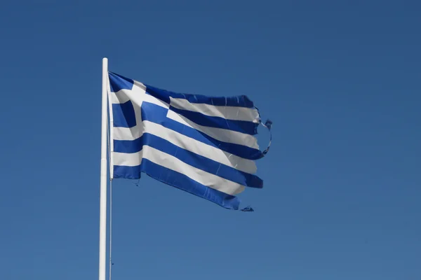 Обірвані грецьким прапором — стокове фото