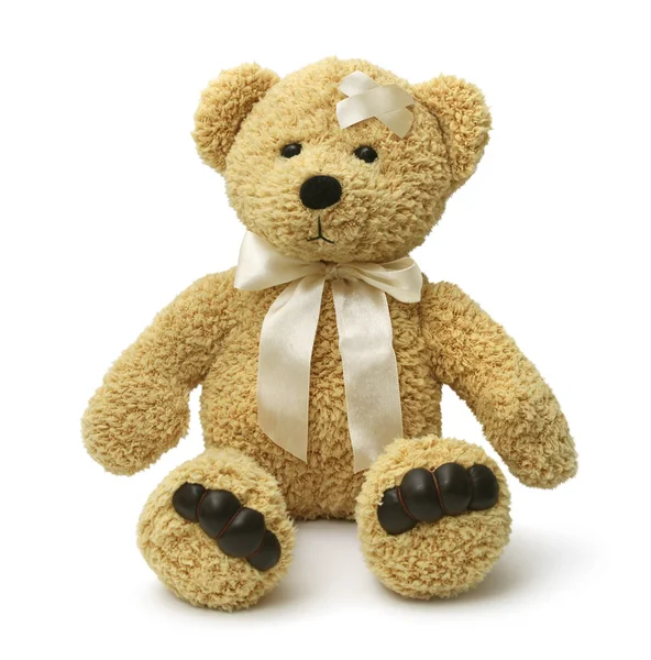 Sad teddy bear injured — Stock Photo, Image