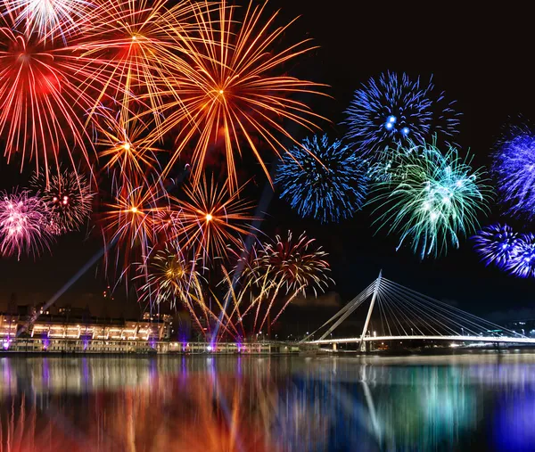 Colorful fireworks near water — Stock Photo, Image