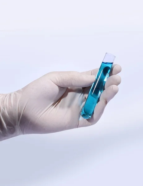 Glass test tube in hand — Stock Photo, Image