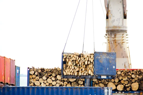 stock image Container witg wood being lifted by a crane