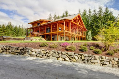 Beautiful large American classic log cabin home. clipart