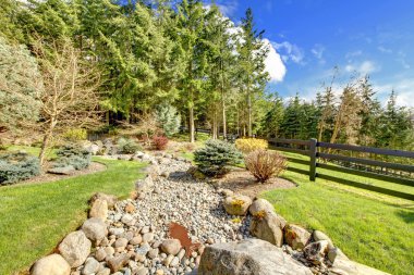 Horse farm rural landscape with rocks and forest. clipart