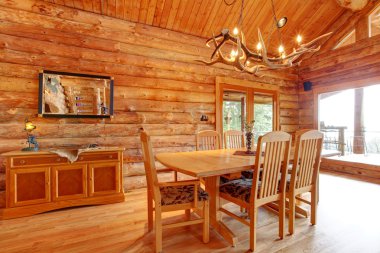 Log cabin dining room interior. clipart