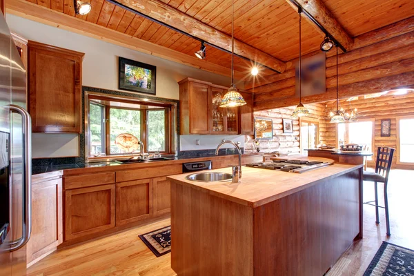Log cabin large kitchen interior. — Stock Photo, Image