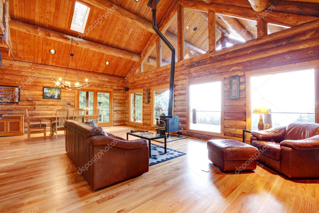 Luxury Log Cabin Living Room With Leather Sofa Stock