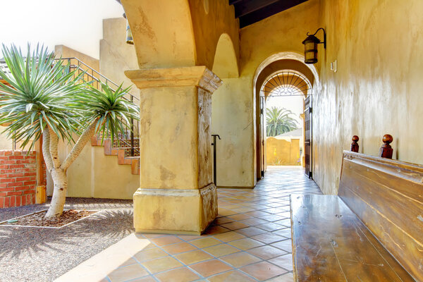 Spanish architecture court yard details with bench.