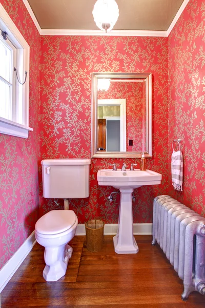 Luxury red and gold small bathroom with silver radiator. — Stock Photo, Image