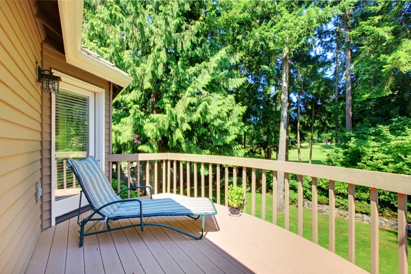 Balcony with summer back yard with pine trees — Stock Photo, Image