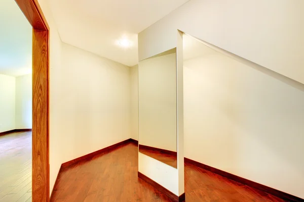 Walk in closet with cherry floor and mirror. — Stock Photo, Image