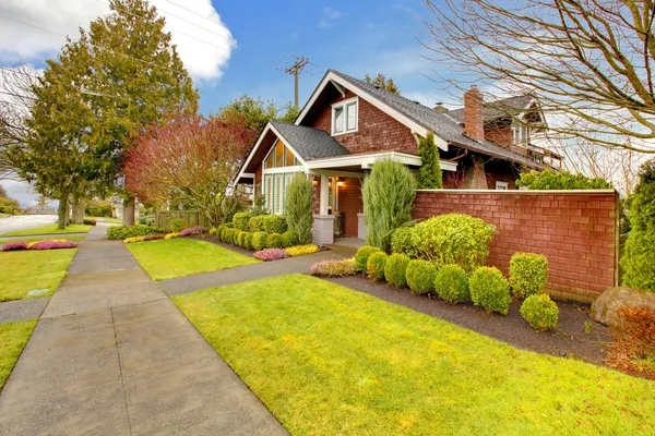 Spring exterior house with brown siding — Stock Photo, Image