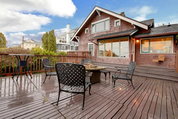 Large brown house with back deck exterior rain winter shot — Stock Photo, Image
