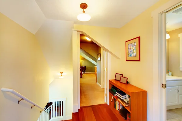 Yellow low ceiling home hallway with staircase interior. — Stock Photo, Image