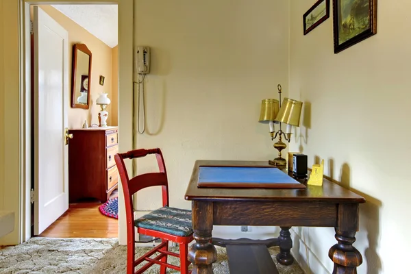 Old desk in hallway English charming house. Stock Image