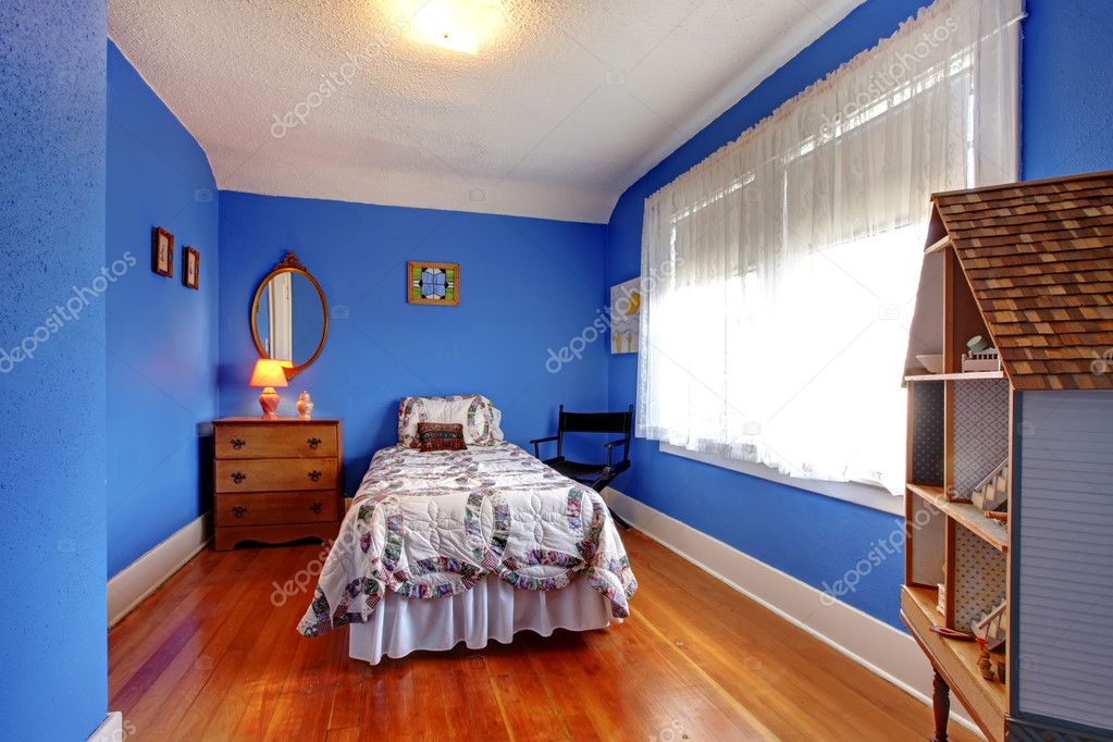 Bright Blue Bedroom With Doll House, Old English On Hardwood Floors