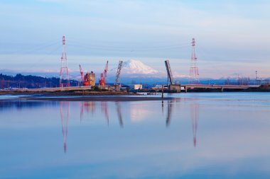 Mt.Ranier and Tacoma port with cranes and bridge. clipart