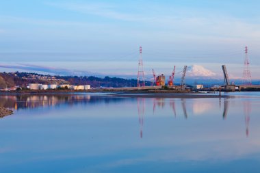 Tacoma port with oil tanks and Mountains. clipart