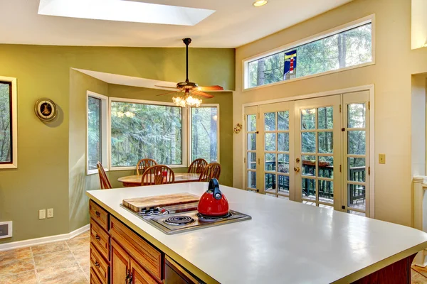 Green large country kitchen with forest view. — Stock Photo, Image