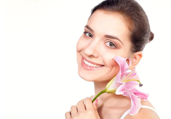 Young beautiful woman with lily flower — Stock Photo, Image