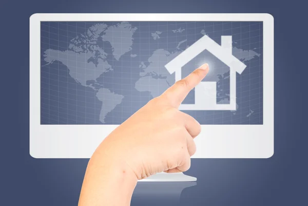 Hand pushing House icon on monitor screen. — Stock Photo, Image