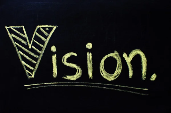 Vision word handwritten with chalk on a blackboard. — Stock Photo, Image