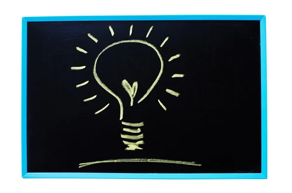 Glödlampa som idén begrepp på tavlan. — Stockfoto