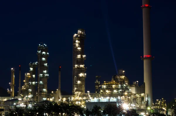 Petrochemical industry on sunset dark blue sky. Royalty Free Stock Photos