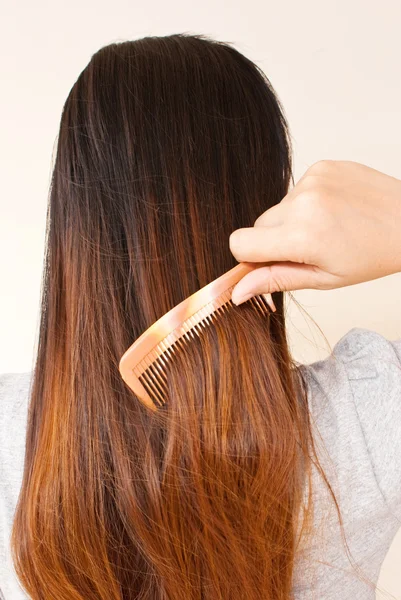 stock image Lady to comb her hair.