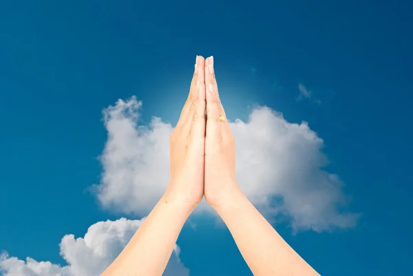 stock image Hand greet on the blue sky.