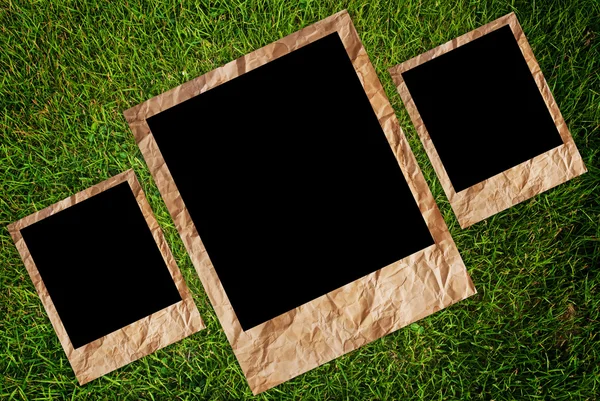 Vintage photo frame on the grass texture background. — Stock Photo, Image