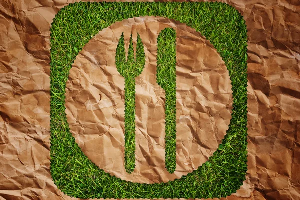 stock image Vintage restaurant symbol on the grass texture background.